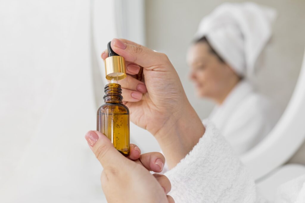 Woman holding a oil bottle for hot oil treatment