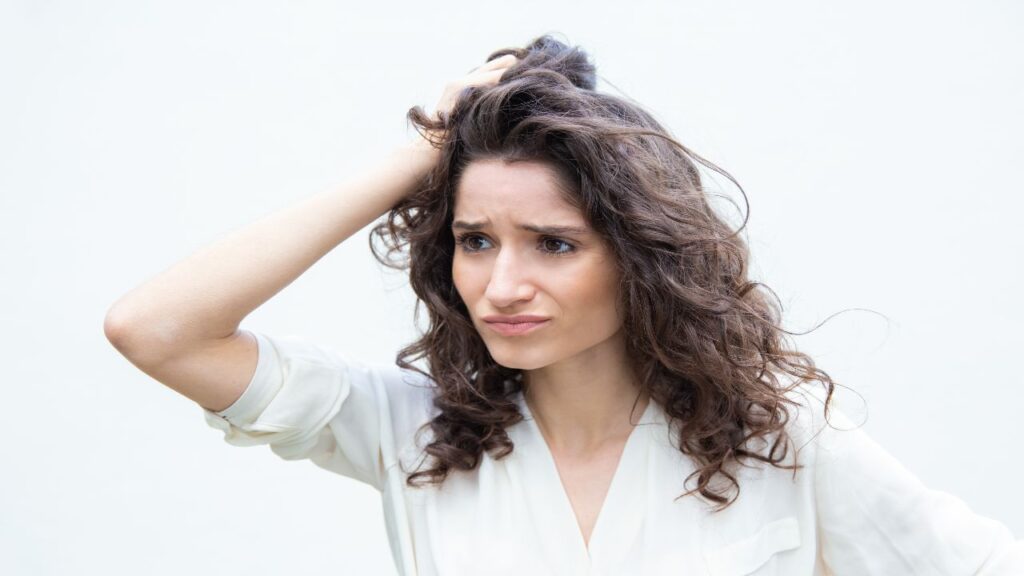 women disturbed with gray edges of her hair